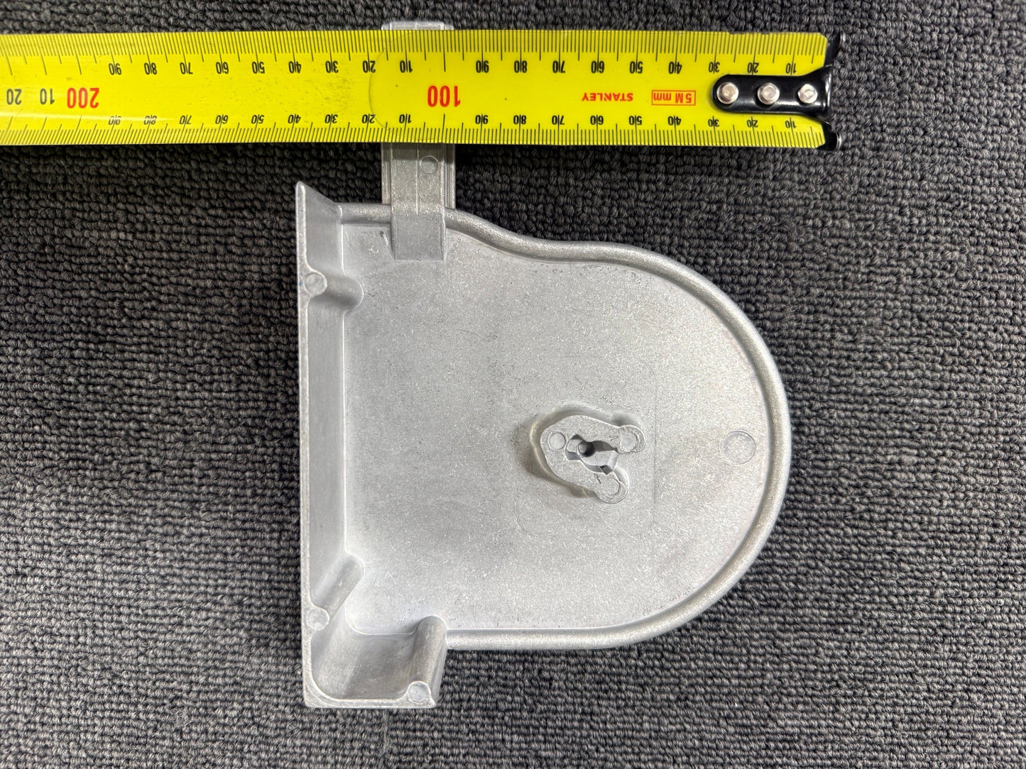 Ziptrak 135mm cast aluminium side frame measured against a tape measure